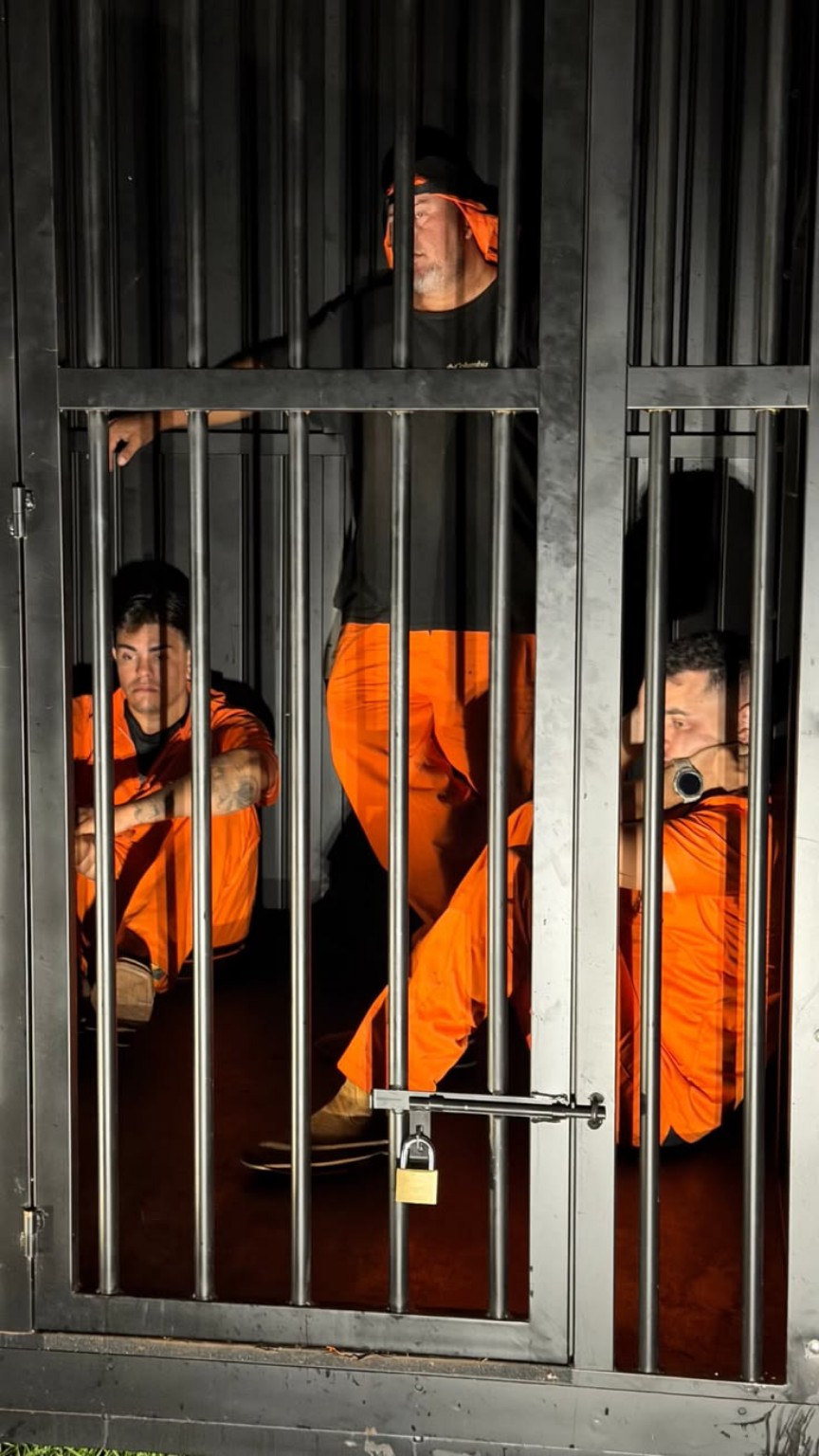 Inmates behind cell bars